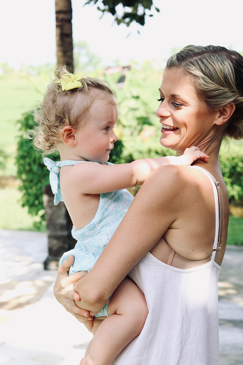 joanna hunt holding daughter and smiling 2