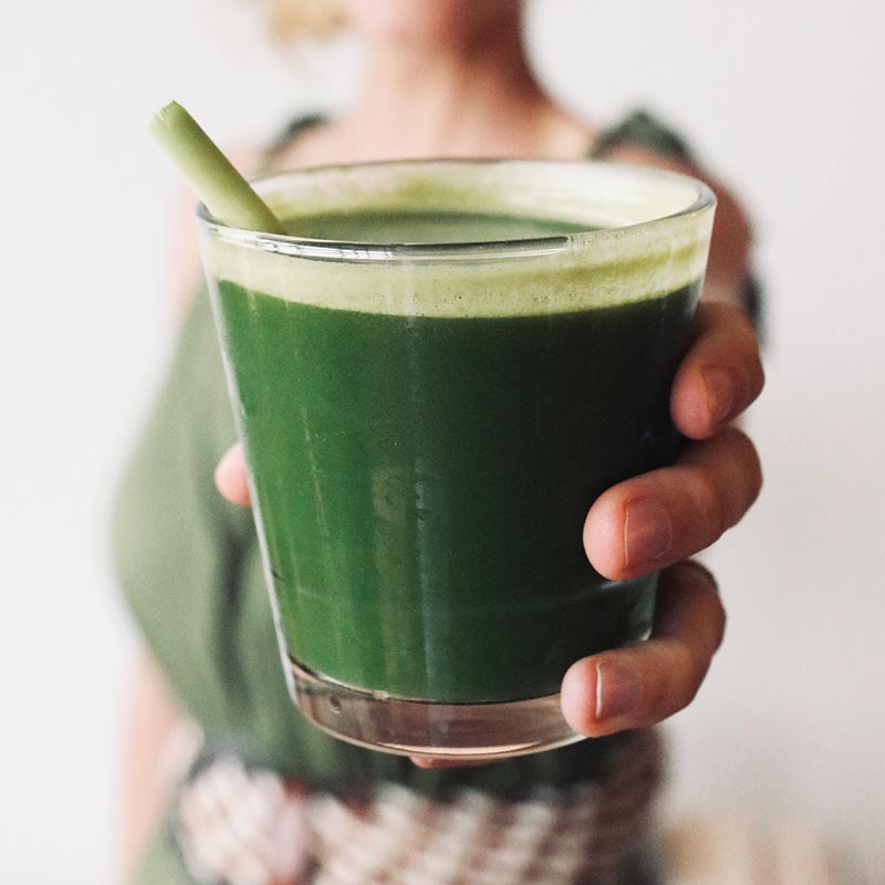 healthy green juice in a glass cup